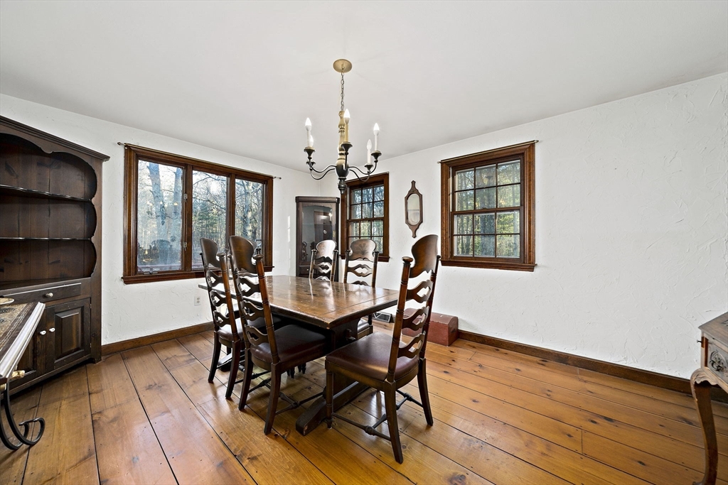 15 Forest Street Plympton, MA 02367 - Photo 9 of 37 a dining room with furniture a chandelier and wooden floor