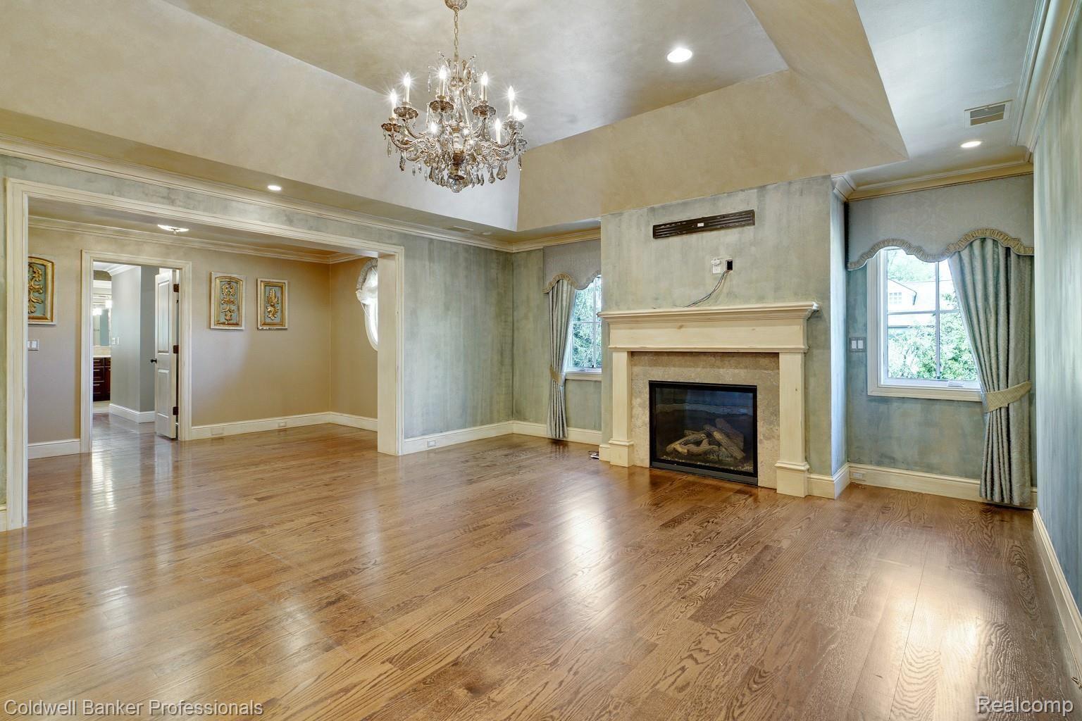 350 Aspen Road Birmingham, MI 48009 - Photo 23 of 60 Master bedroom with fireplace, tray ceiling and sitting area