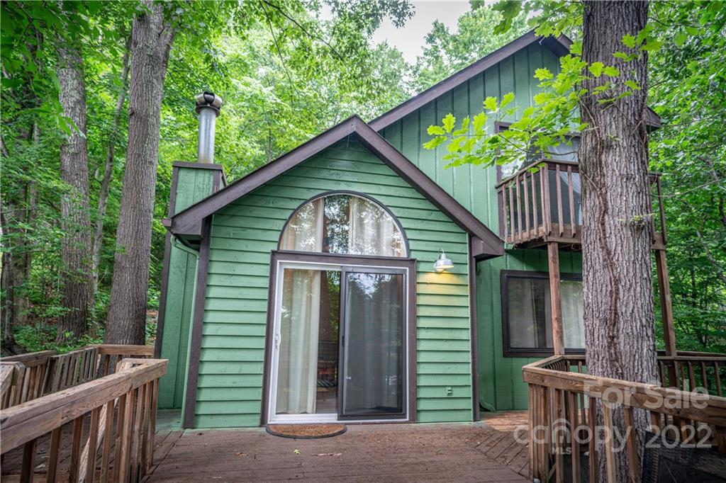 37 Country Road Clyde, NC 28721 - Photo 1 of 46 a front view of a house with garden