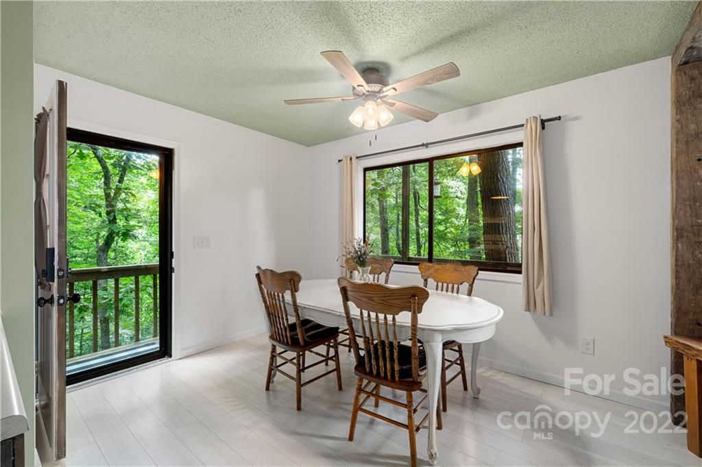 37 Country Road Clyde, NC 28721 - Photo 14 of 46 a view of a dining room with furniture window and outside view