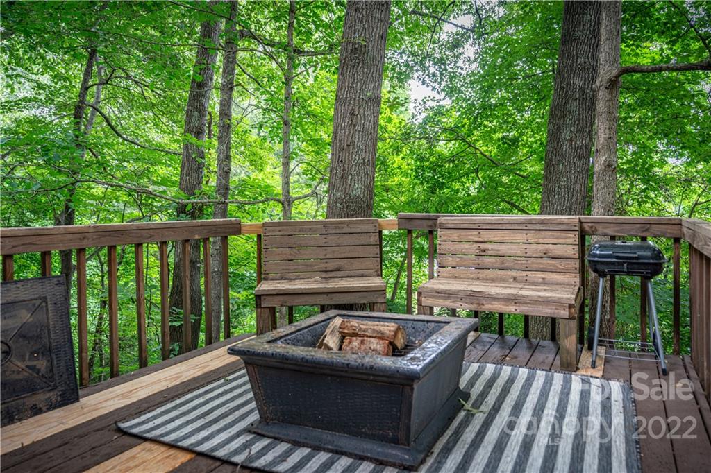 37 Country Road Clyde, NC 28721 - Photo 6 of 46 a view of a wooden deck with a bench