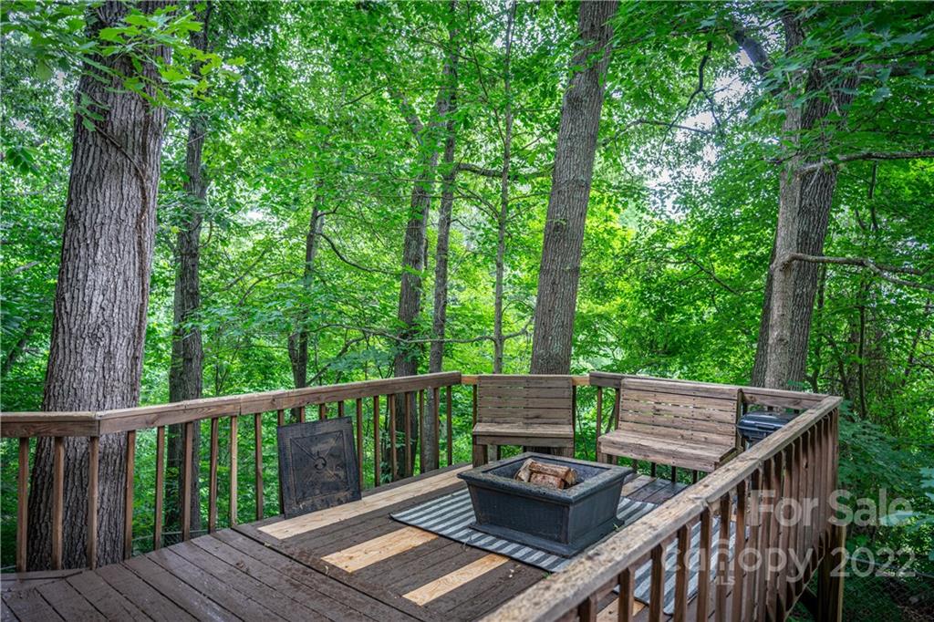 37 Country Road Clyde, NC 28721 - Photo 7 of 46 a view of house with deck and trees