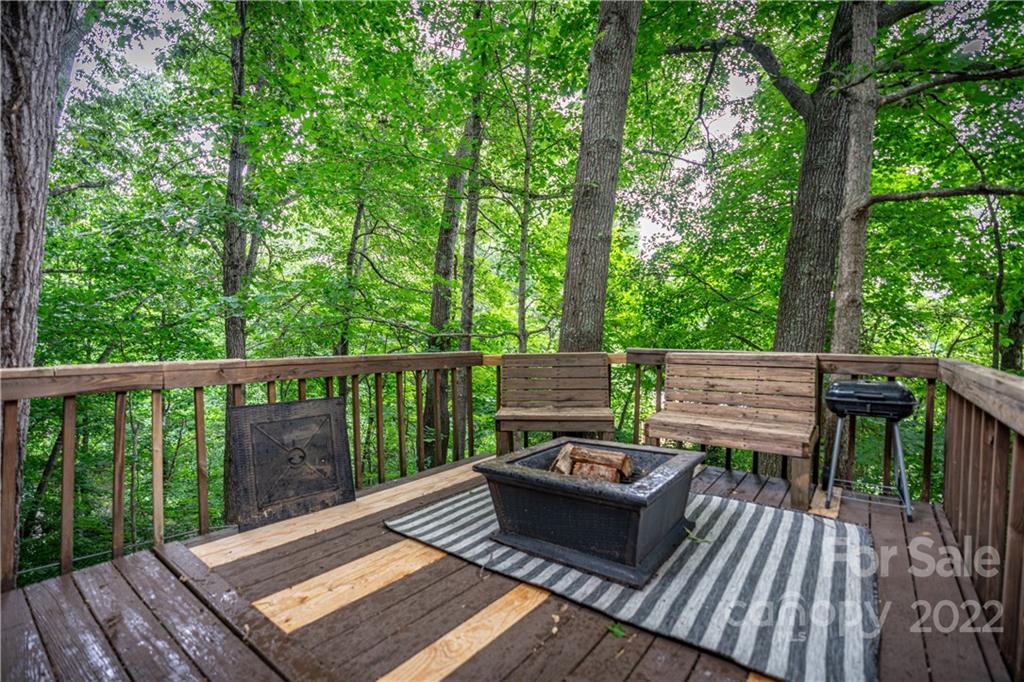 37 Country Road Clyde, NC 28721 - Photo 8 of 46 a view of a wooden deck with furniture