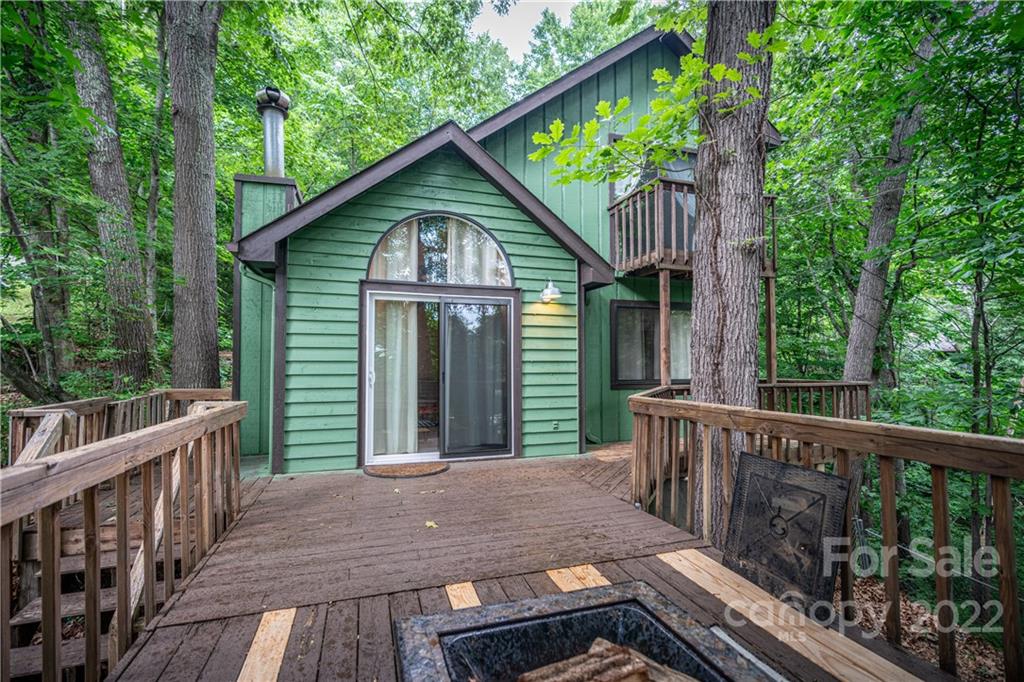 37 Country Road Clyde, NC 28721 - Photo 9 of 46 a view of a wooden deck and a backyard