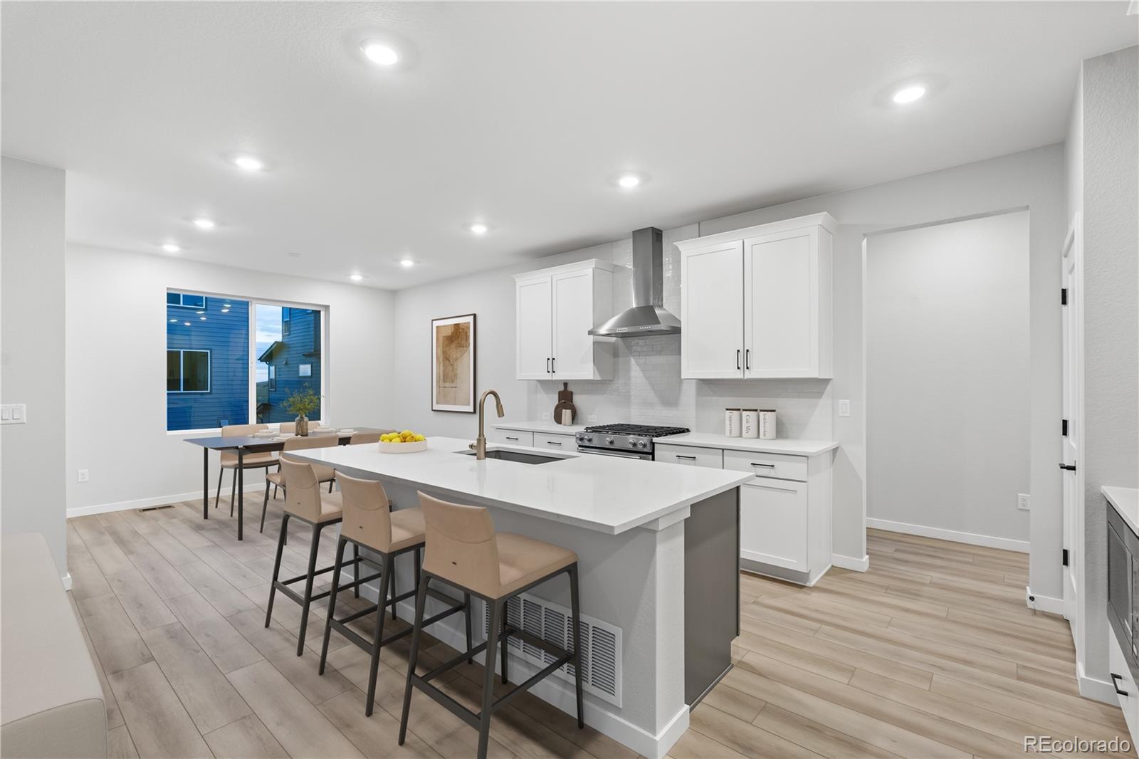 12051 Amplify Circle Lone Tree, CO 80134 - Photo 16 of 34 a kitchen with a table and chairs in it