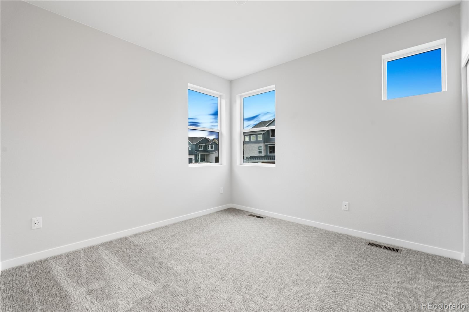 12051 Amplify Circle Lone Tree, CO 80134 - Photo 29 of 34 an empty room with windows