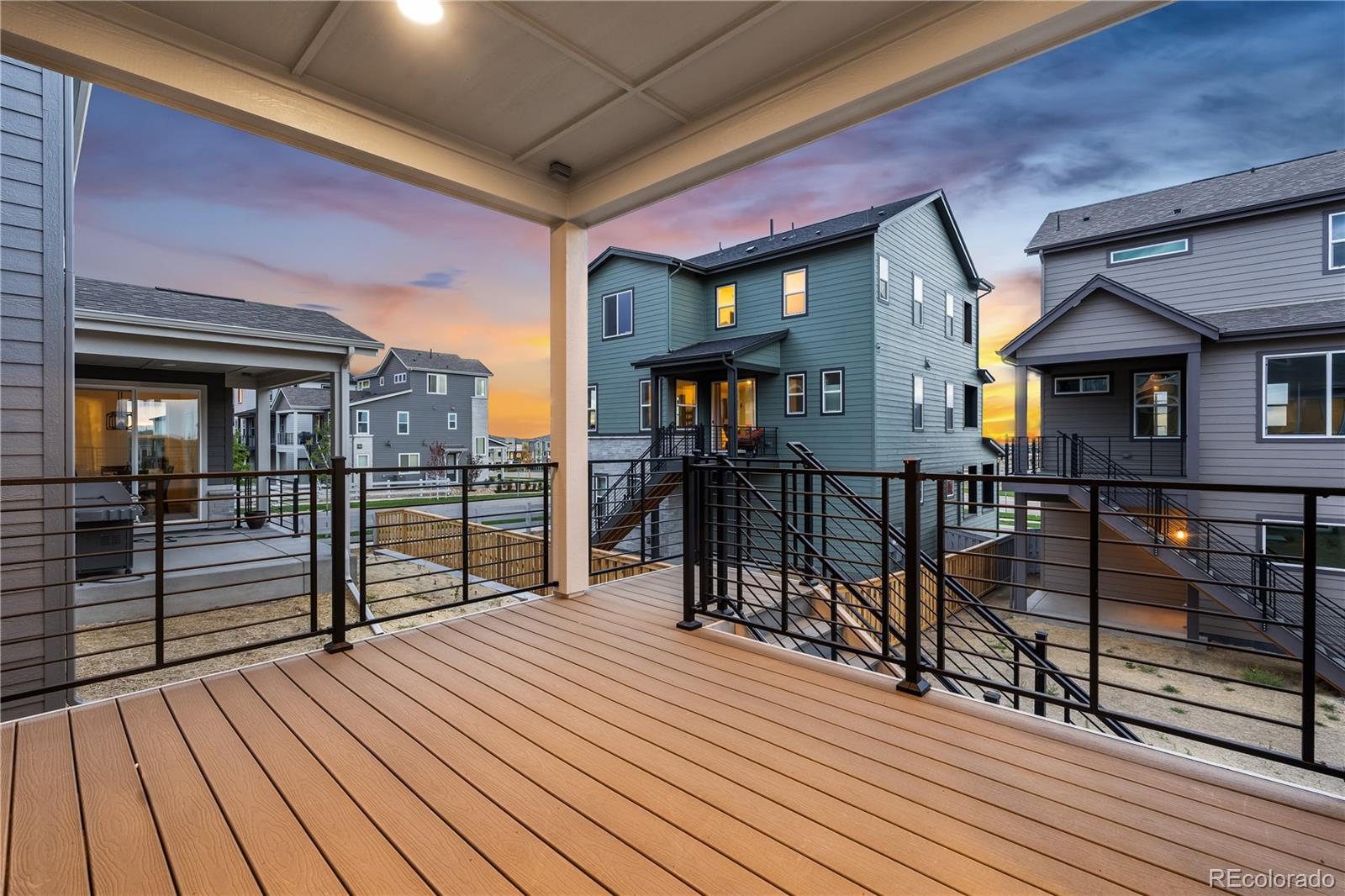 12051 Amplify Circle Lone Tree, CO 80134 - Photo 3 of 34 a view of a balcony with wooden floor and furniture