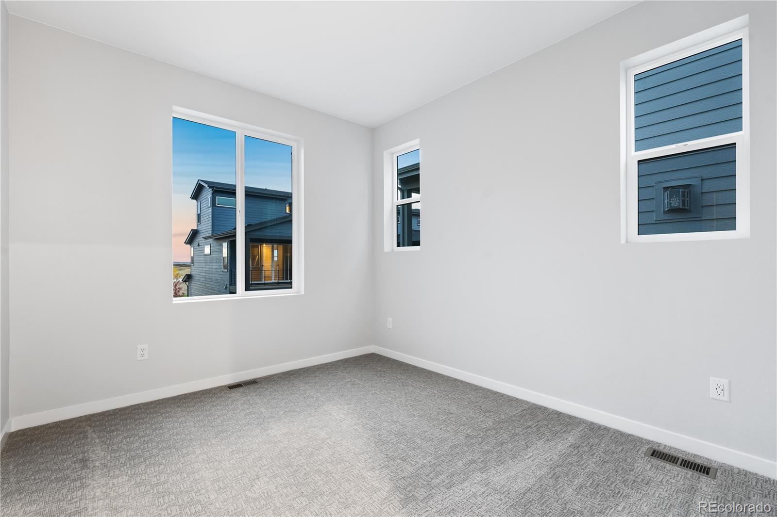 12051 Amplify Circle Lone Tree, CO 80134 - Photo 31 of 34 an empty room with windows