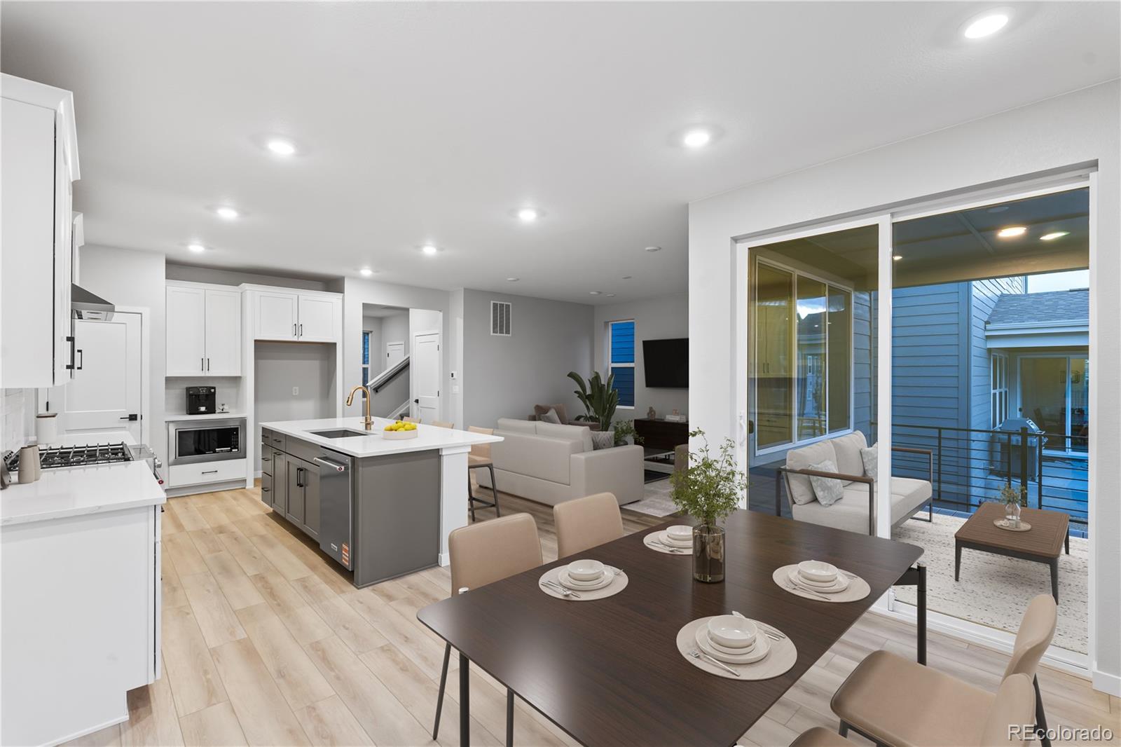 12051 Amplify Circle Lone Tree, CO 80134 - Photo 4 of 34 a open dining room with furniture wooden floor kitchen view and kitchen view