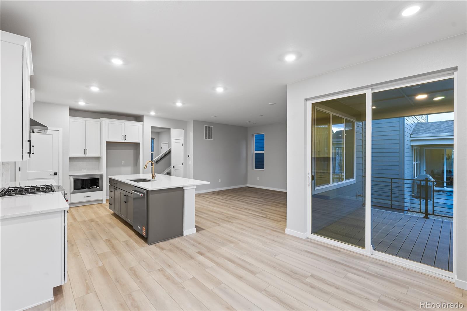 12051 Amplify Circle Lone Tree, CO 80134 - Photo 5 of 34 a kitchen with a sink and a refrigerator