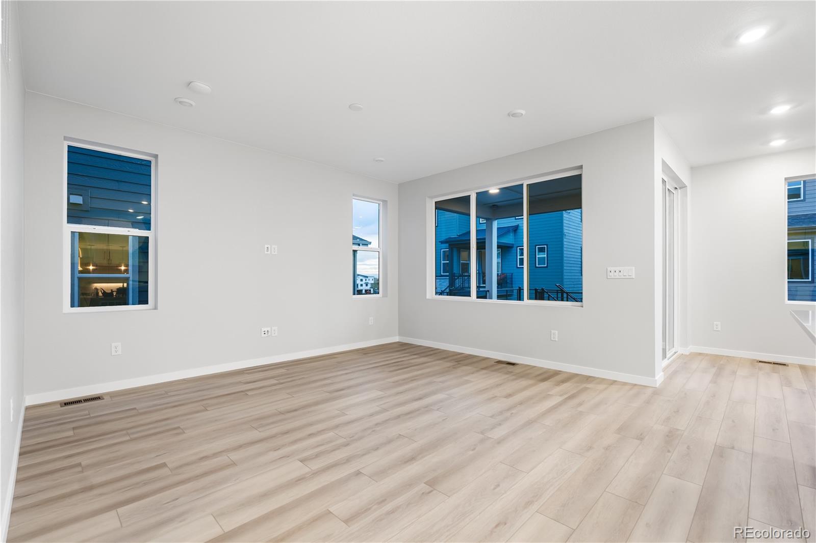 12051 Amplify Circle Lone Tree, CO 80134 - Photo 8 of 34 a view of an empty room with wooden floor and a window