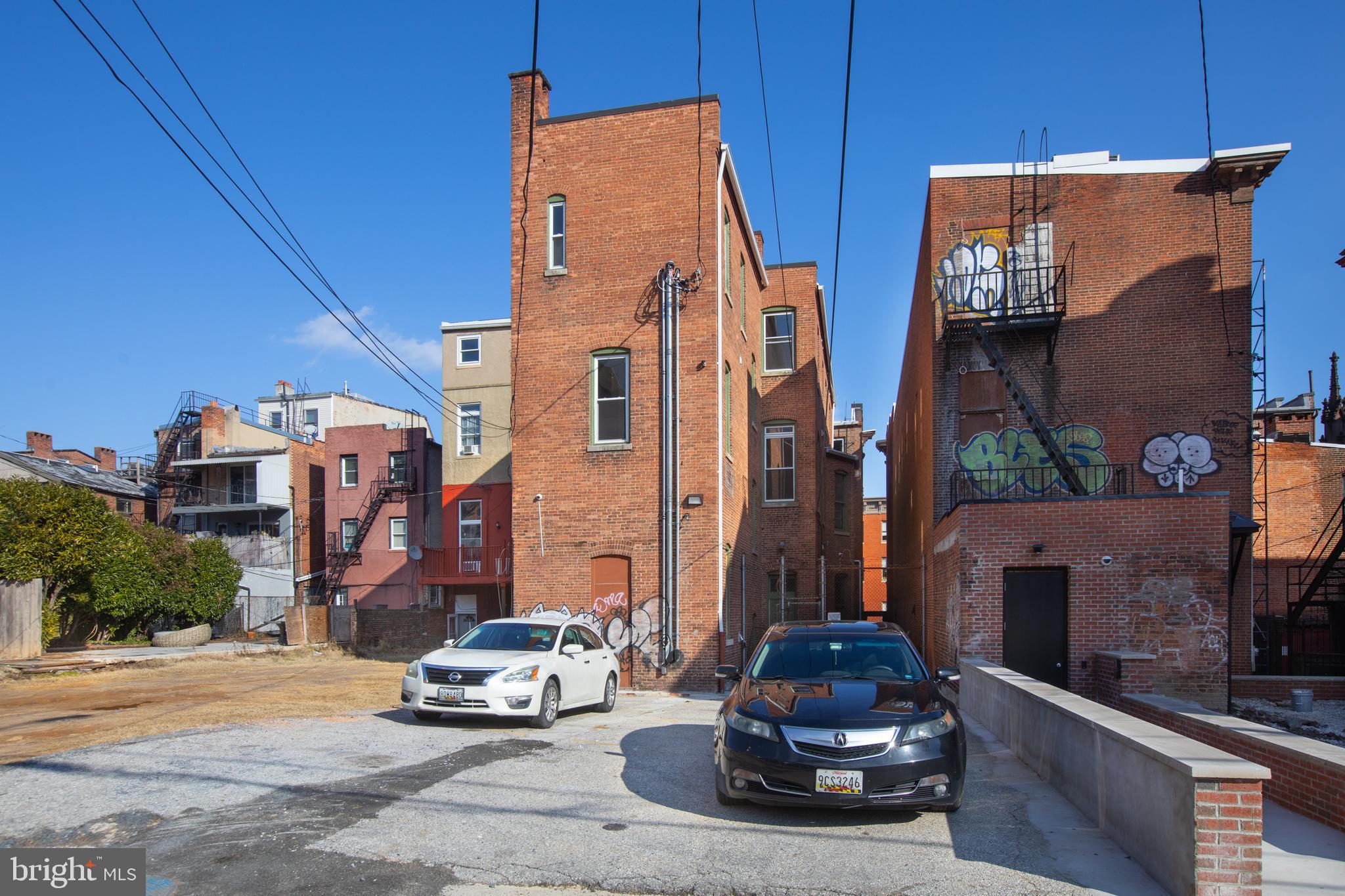 812 Park Avenue, Unit LL Baltimore, MD 21201 - Photo 16 of 16 a car parked in front of a house