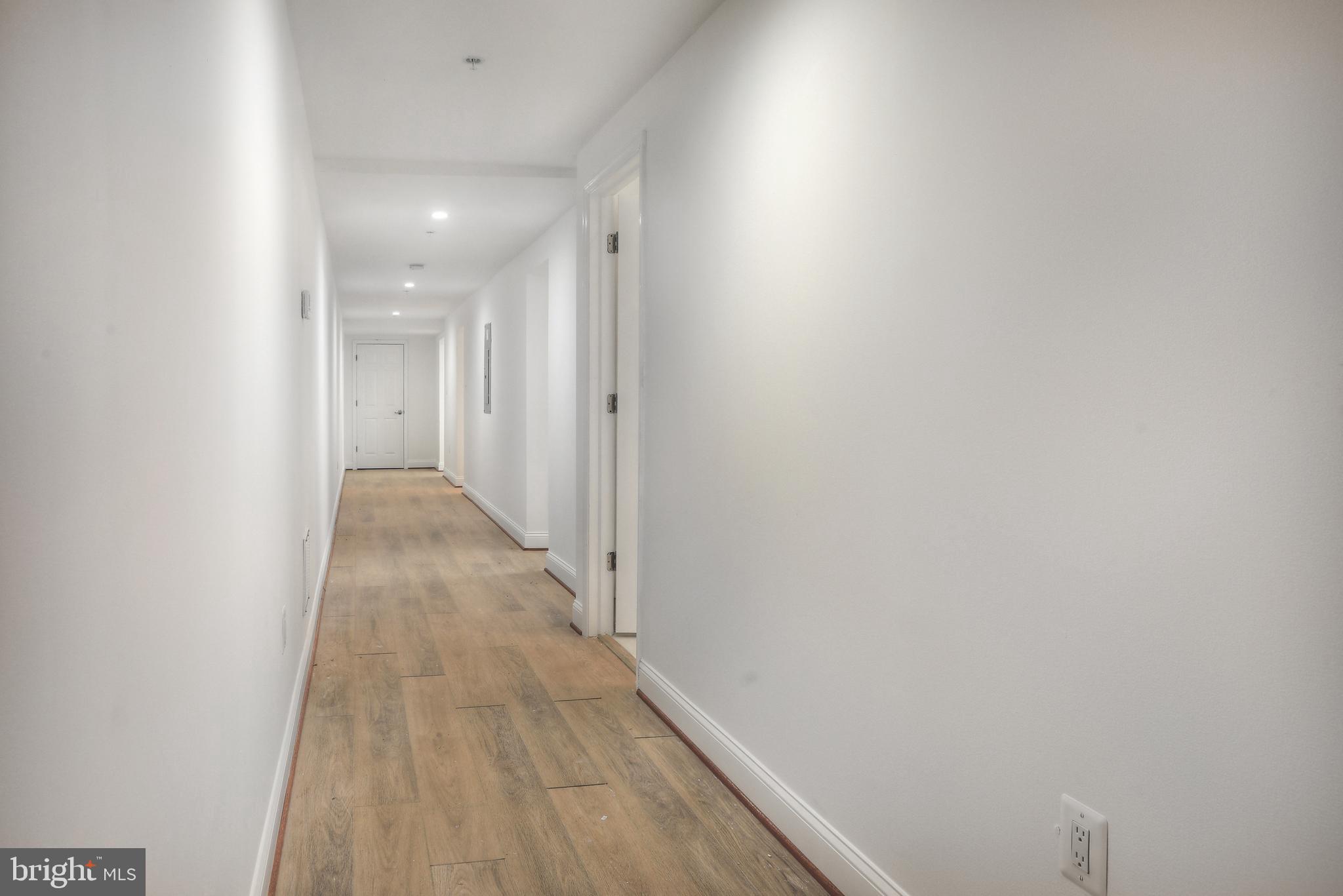 812 Park Avenue, Unit LL Baltimore, MD 21201 - Photo 7 of 16 a view of a hallway with wooden floor