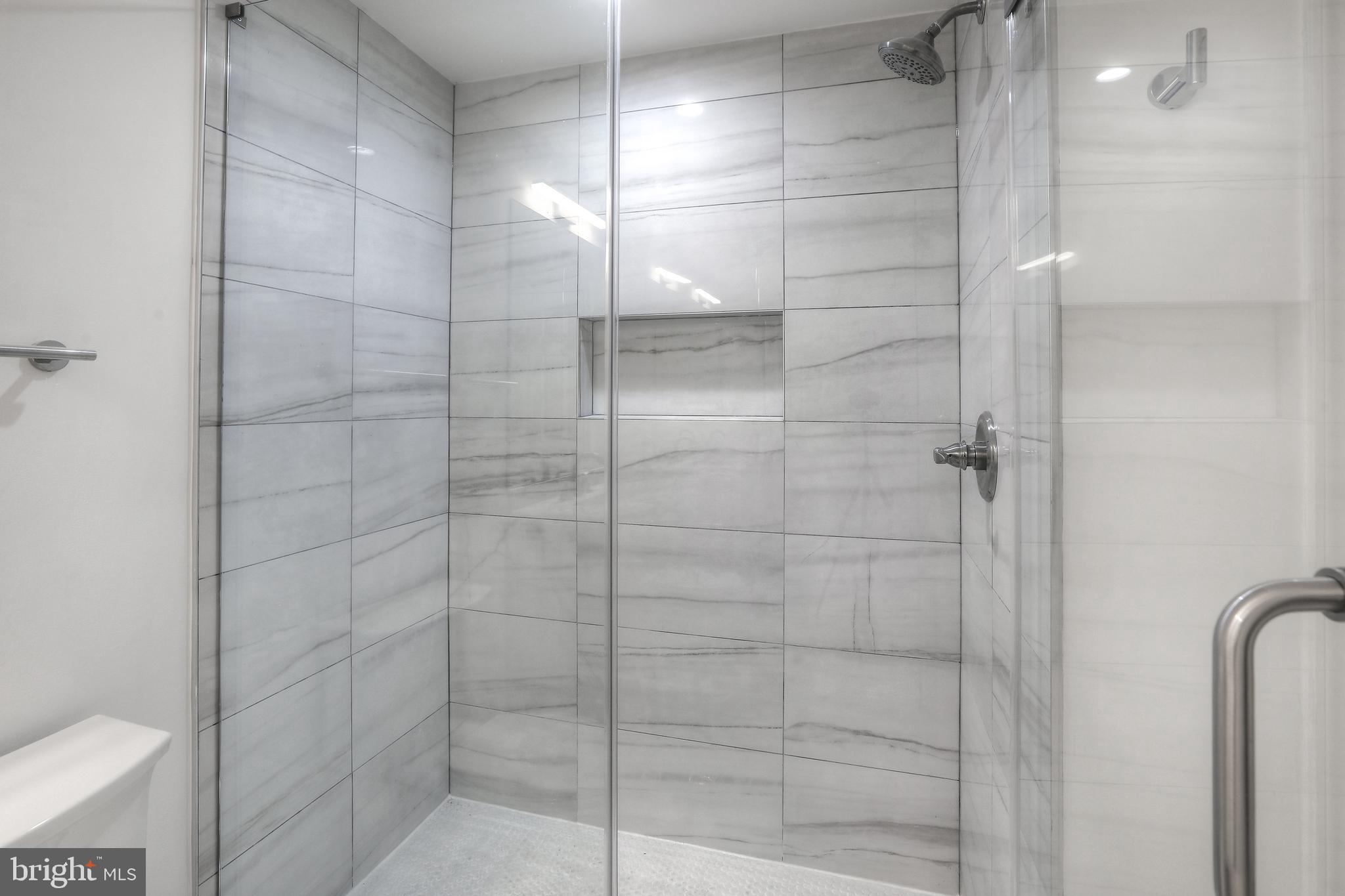 812 Park Avenue, Unit LL Baltimore, MD 21201 - Photo 10 of 16 a bathroom with a shower