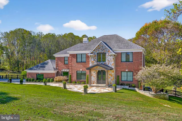 a front view of a house with a garden and porch