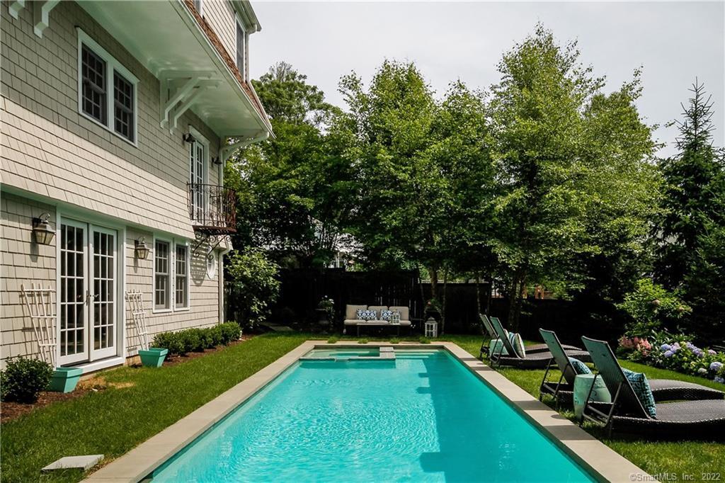 16 Turkey Hill Road South Westport, CT 06880 - Photo 1 of 1 a view of a house with swimming pool and sitting area
