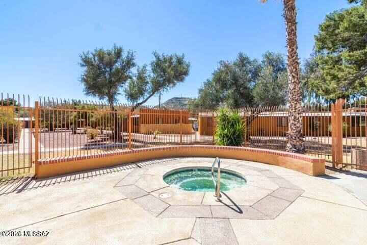 350 North Silverbell Road, Unit 94 Tucson, AZ 85745 - Photo 14 of 15 a view of a swimming pool with a patio