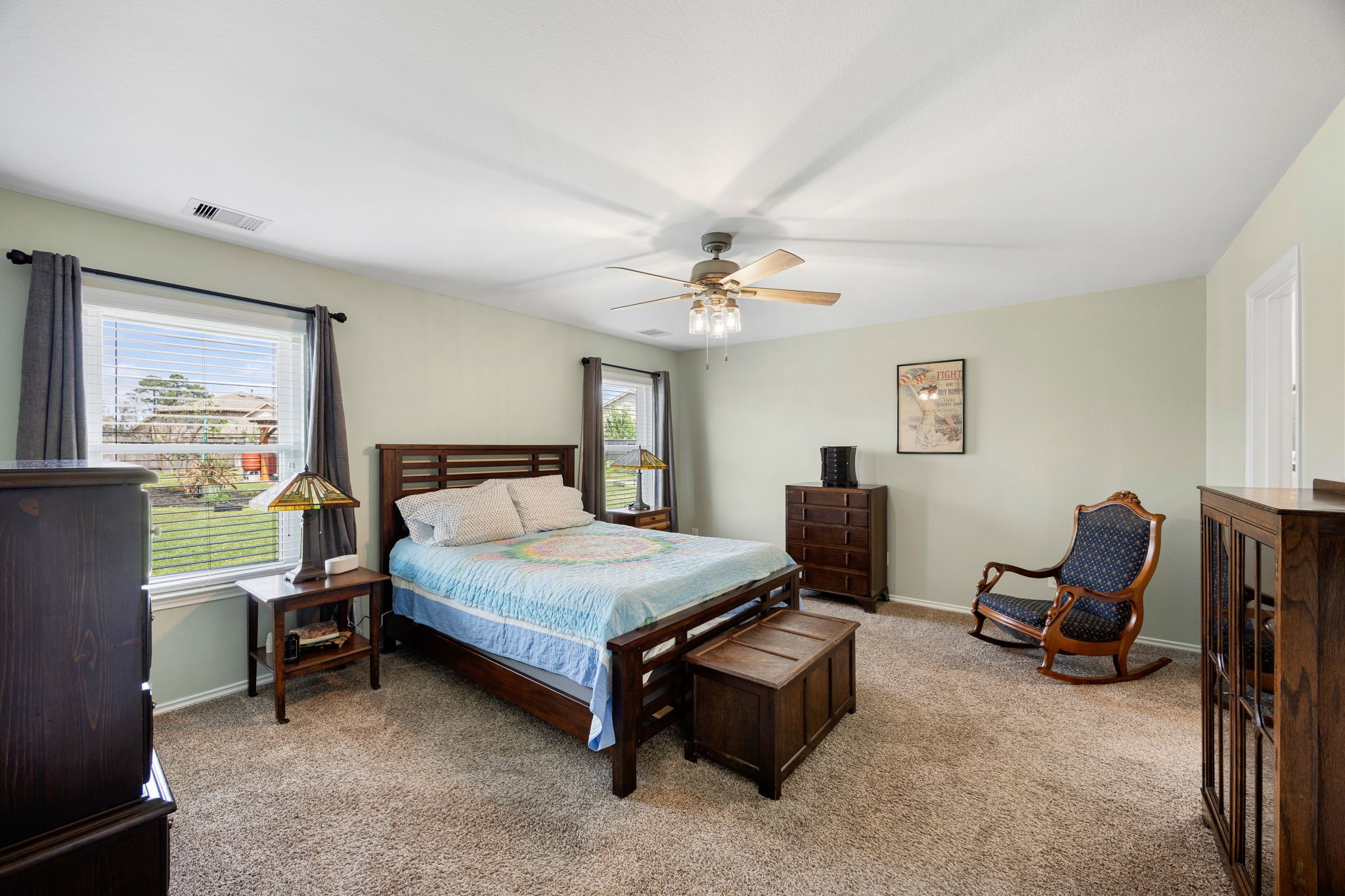2627 Ski Lodge Drive Spring, TX 77373 - Photo 13 of 30 a bedroom with a bed and a chandelier