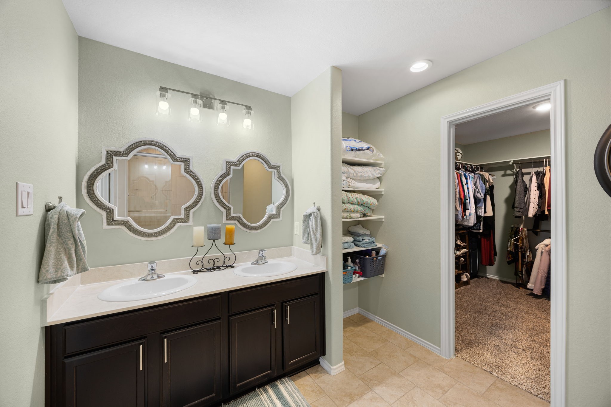 2627 Ski Lodge Drive Spring, TX 77373 - Photo 14 of 30 a bathroom with a double vanity sink and a mirror