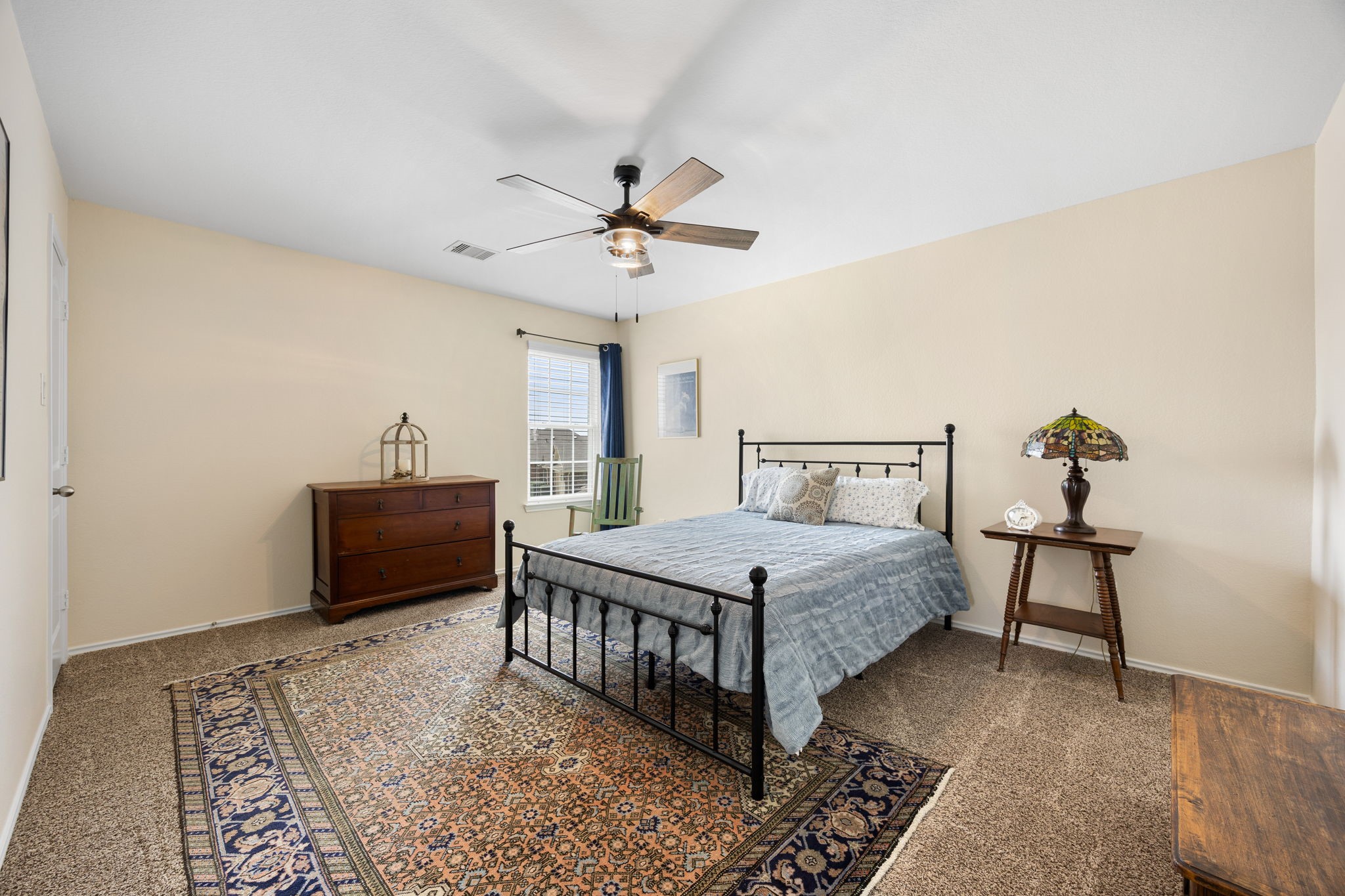 2627 Ski Lodge Drive Spring, TX 77373 - Photo 16 of 30 a bedroom with a bed and a chandelier