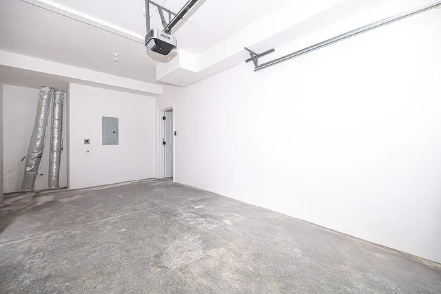 a view of a livingroom with a ceiling fan and window