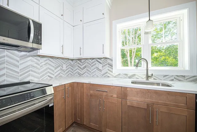 a kitchen with a sink and a microwave