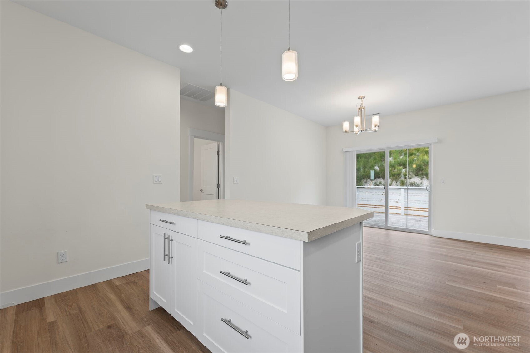 19015 Highway 3, Unit AB Allyn, WA 98524 - Photo 23 of 31 a view of a kitchen with a sink wooden floor and a window