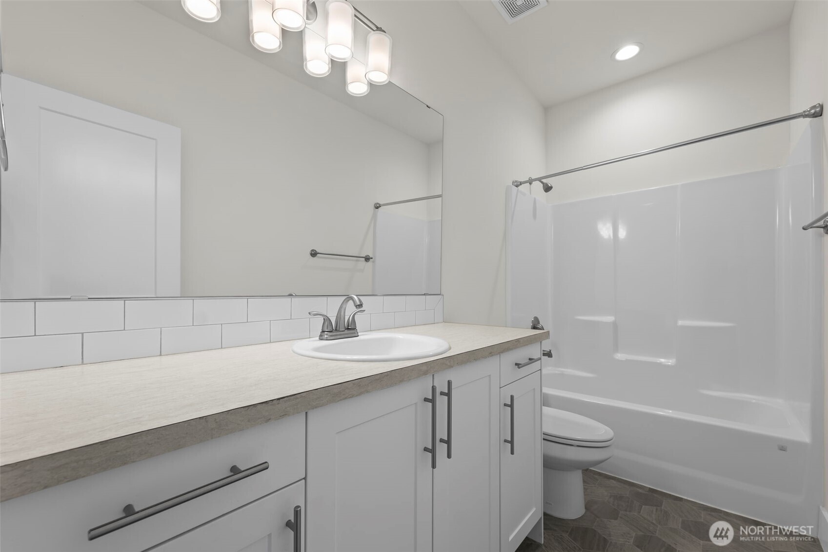 19015 Highway 3, Unit AB Allyn, WA 98524 - Photo 26 of 31 a bathroom with a granite countertop sink a toilet and shower