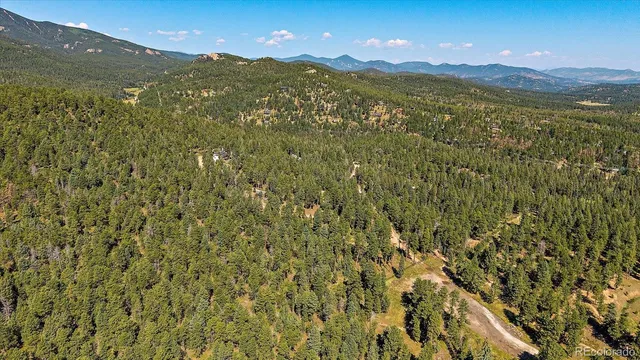 a view of a city with mountains in the background
