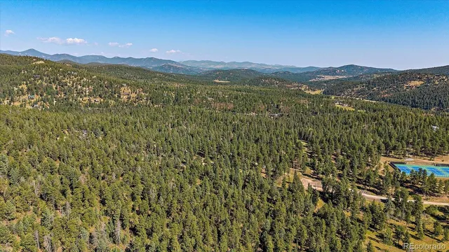 a view of a city with mountains in the background