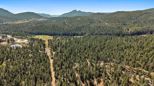 a view of a town with mountains in the background