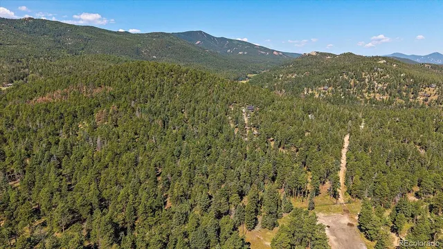 a view of a mountain view with mountains in the background