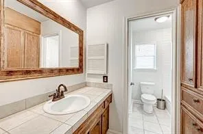 an empty room with closet and fan