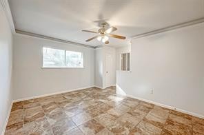 12415 Nova Drive Houston, TX 77077 - Photo 14 of 16 a view of a room with a ceiling fan and a window