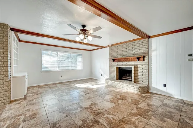 a kitchen with granite countertop a sink stove and refrigerator