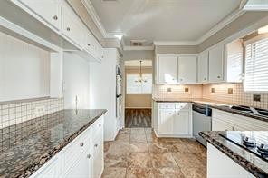 12415 Nova Drive Houston, TX 77077 - Photo 9 of 16 a kitchen with a sink stove and cabinets