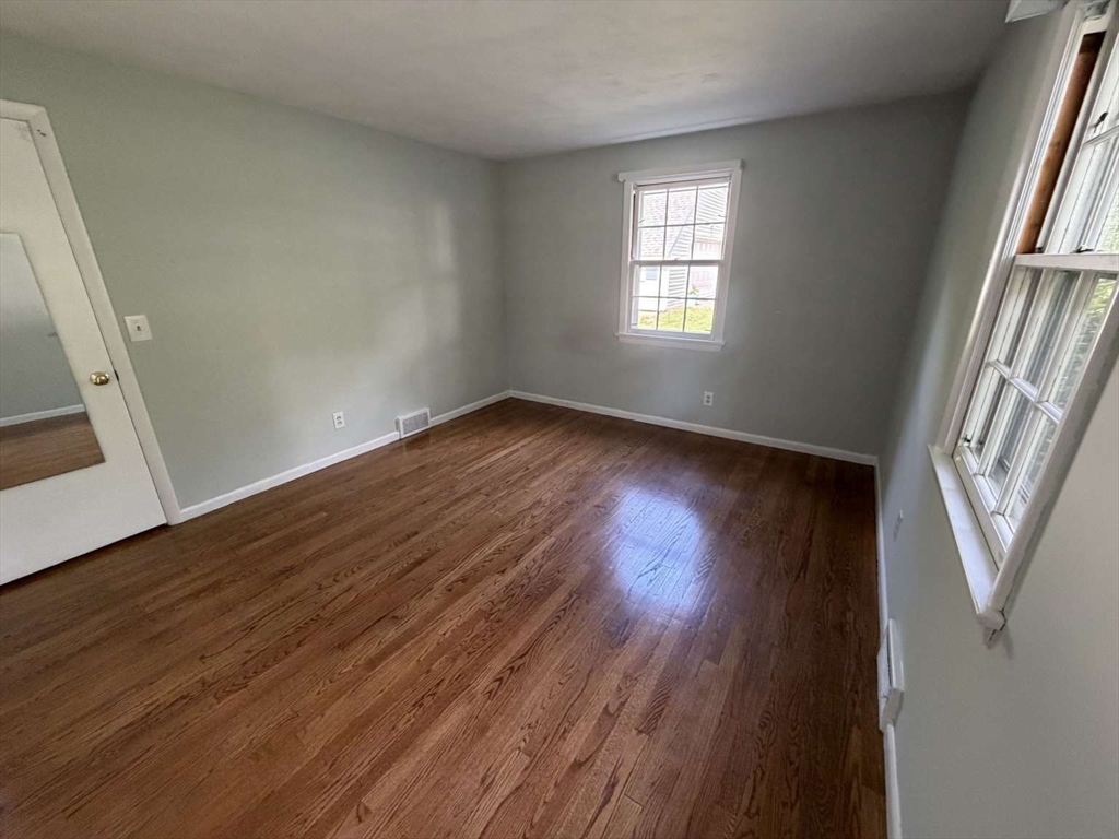74 Birch Road Longmeadow, MA 01106 - Photo 13 of 38 an empty room with wooden floor and windows