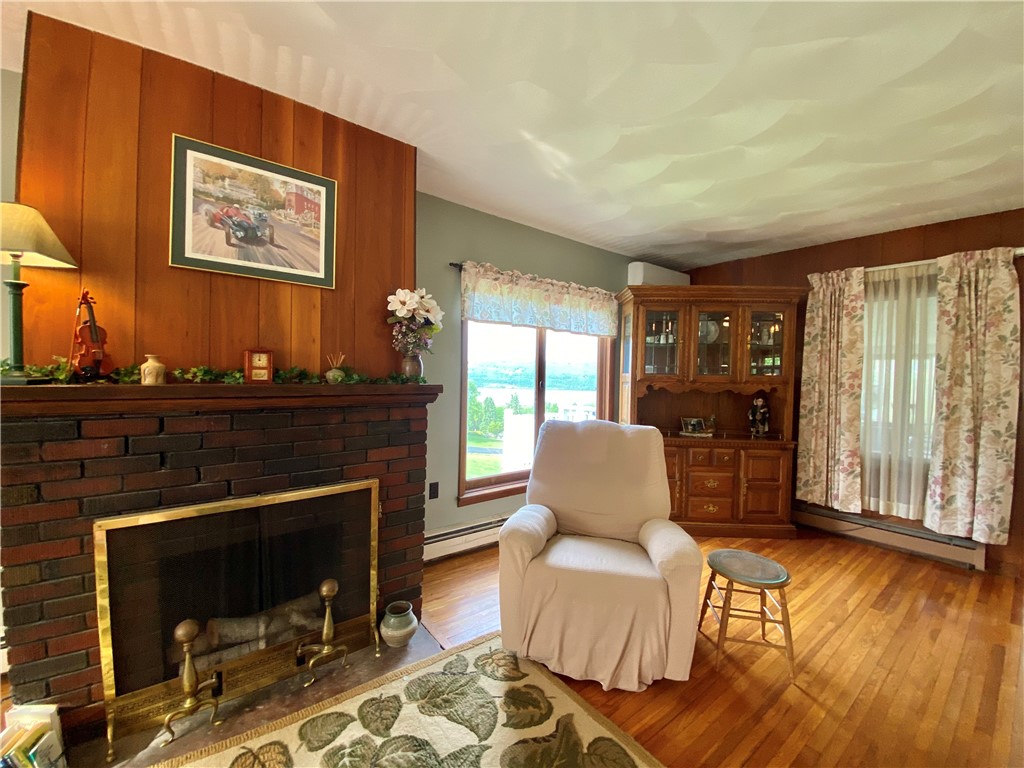 246 Lee Road Reading, NY 14891 - Photo 9 of 41 Living Room Fireplace w/Lake view from window