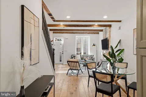 a dining room with furniture and entryway