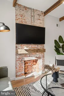 a view of living room with furniture and a flat screen tv