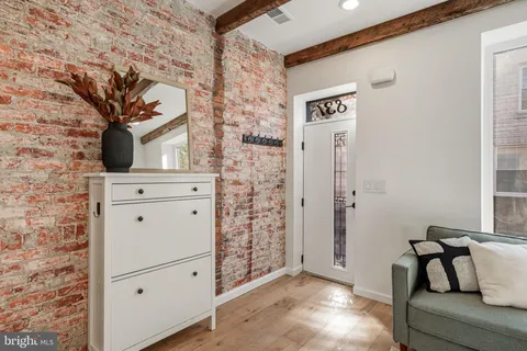 a view of a hallway with seating area