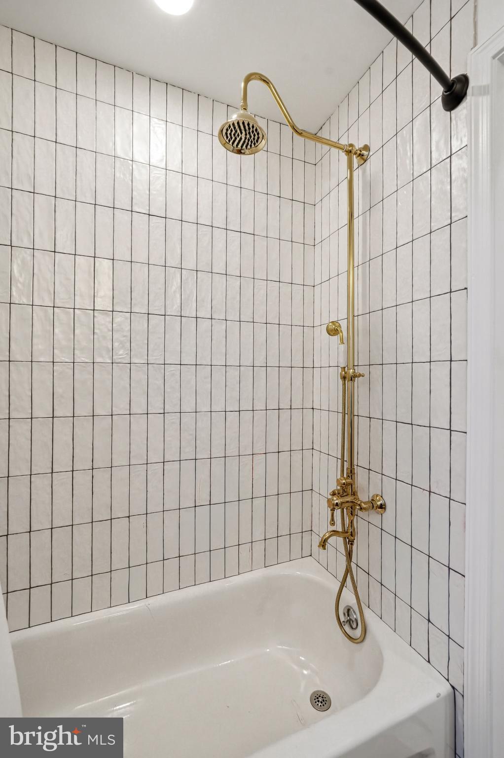 831 North Stillman Street Philadelphia, PA 19130 - Photo 22 of 35 a bathroom with a bathtub and shower