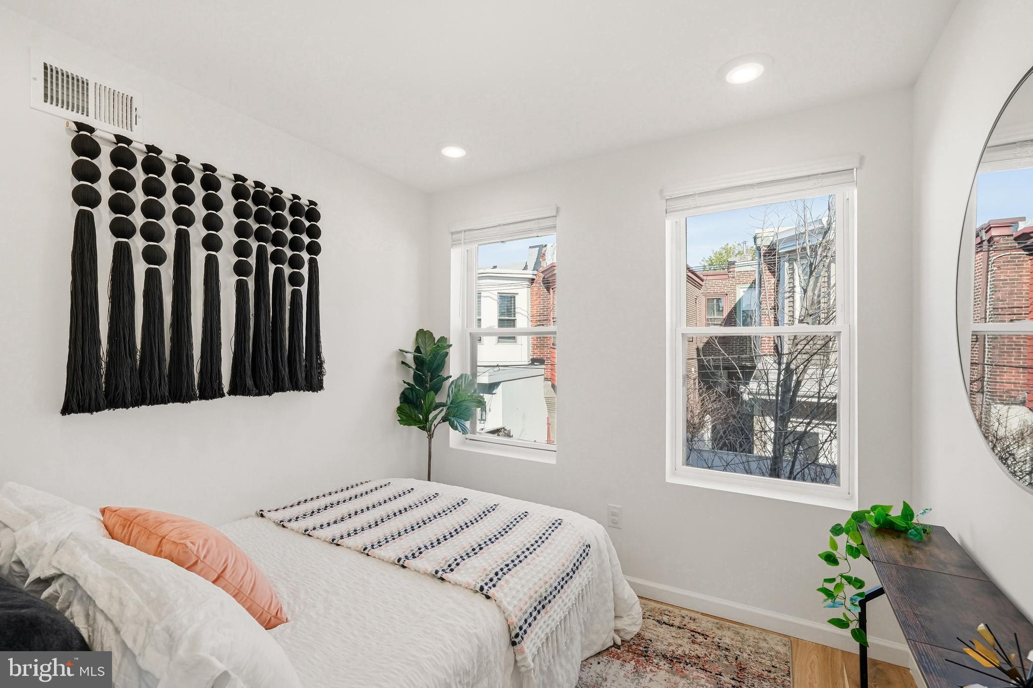 831 North Stillman Street Philadelphia, PA 19130 - Photo 23 of 35 a bedroom with a bed and a window