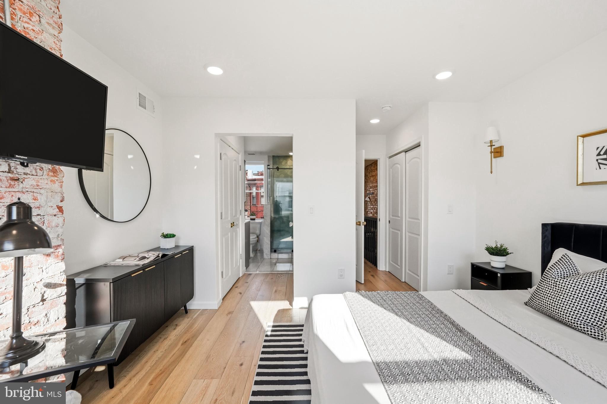 831 North Stillman Street Philadelphia, PA 19130 - Photo 27 of 35 a bedroom with a bed and a flat screen tv