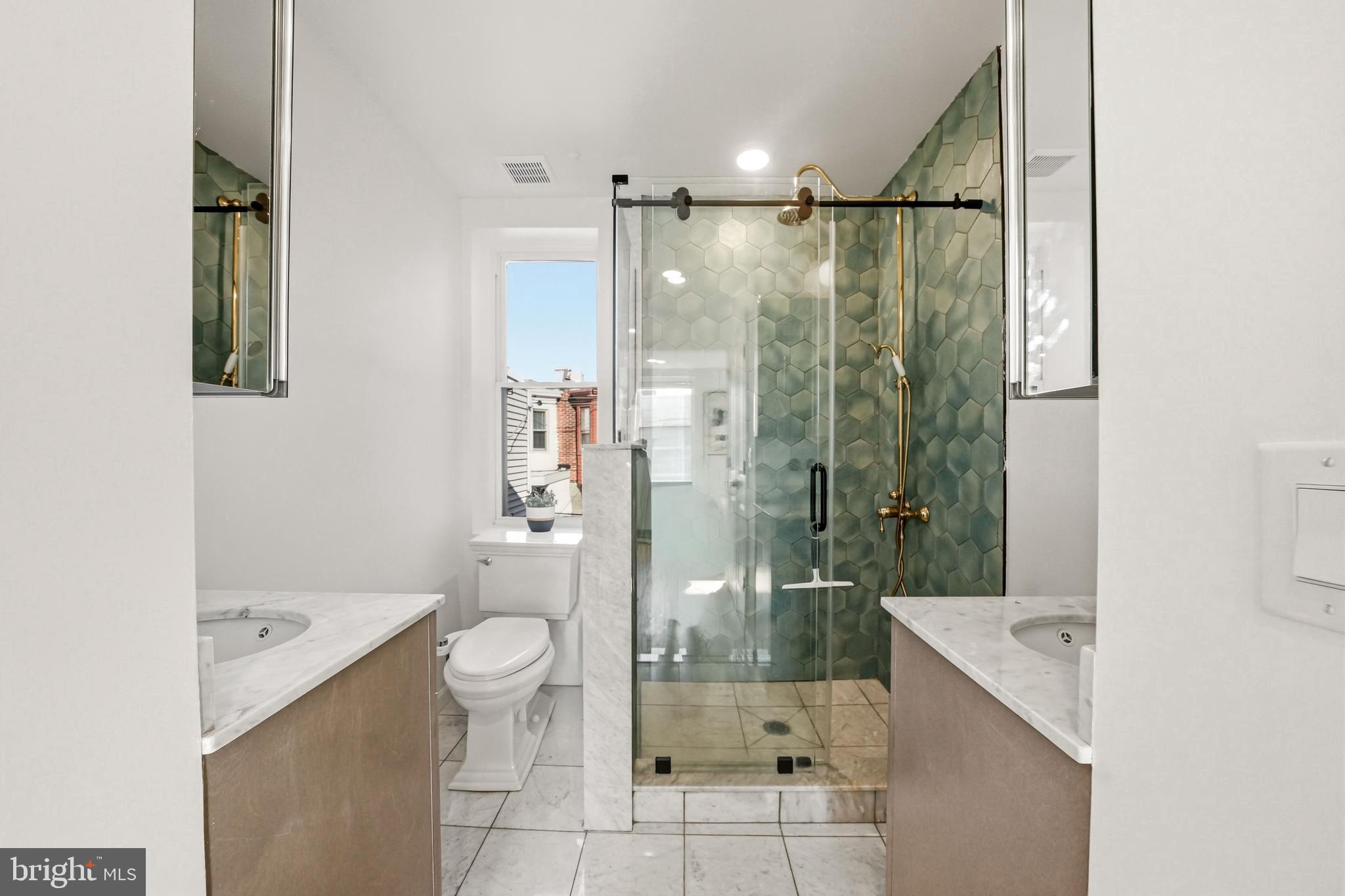 831 North Stillman Street Philadelphia, PA 19130 - Photo 28 of 35 a bathroom with a shower sink vanity mirror and toilet
