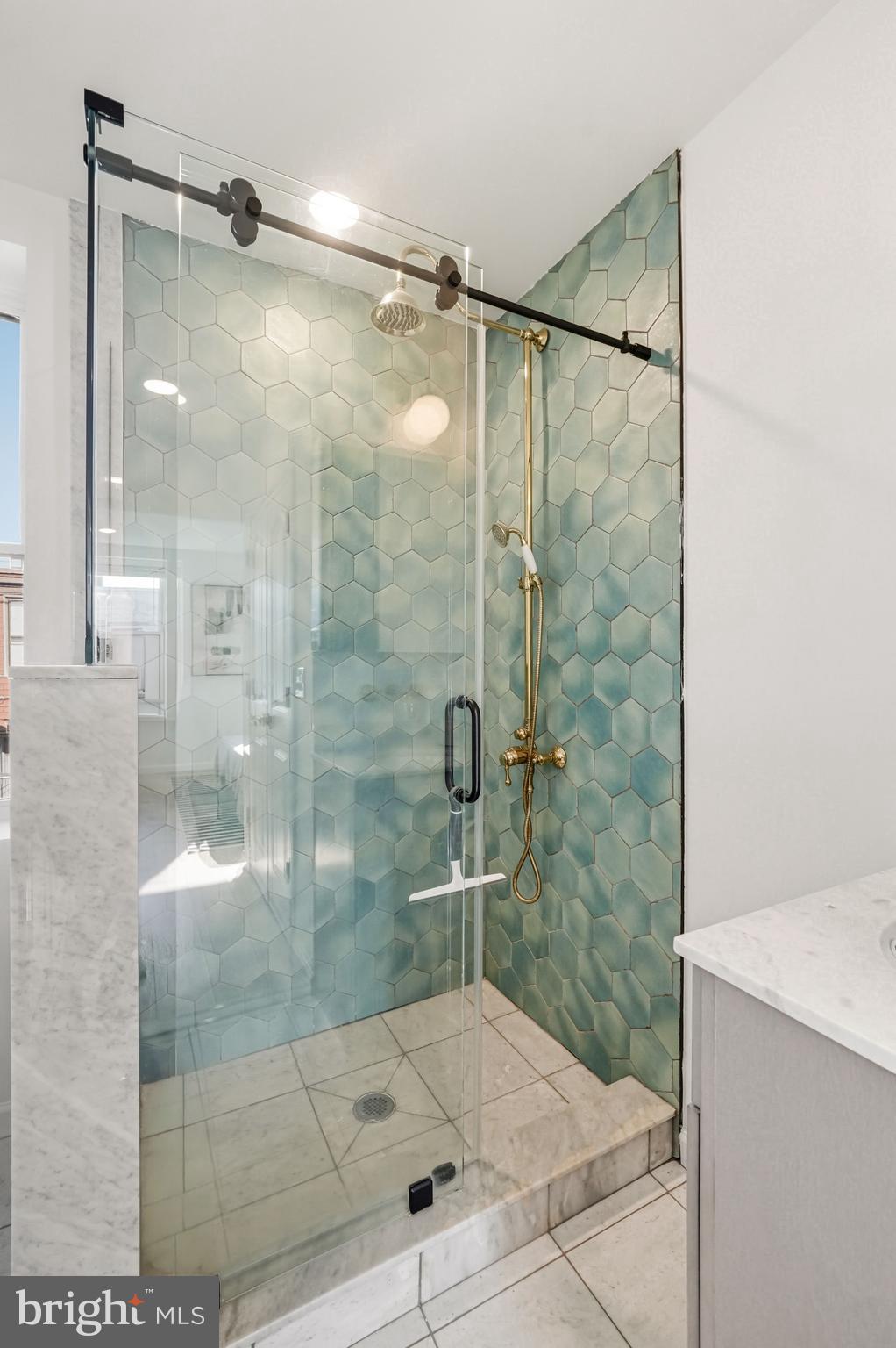 831 North Stillman Street Philadelphia, PA 19130 - Photo 29 of 35 a bathroom that has a glass shower door