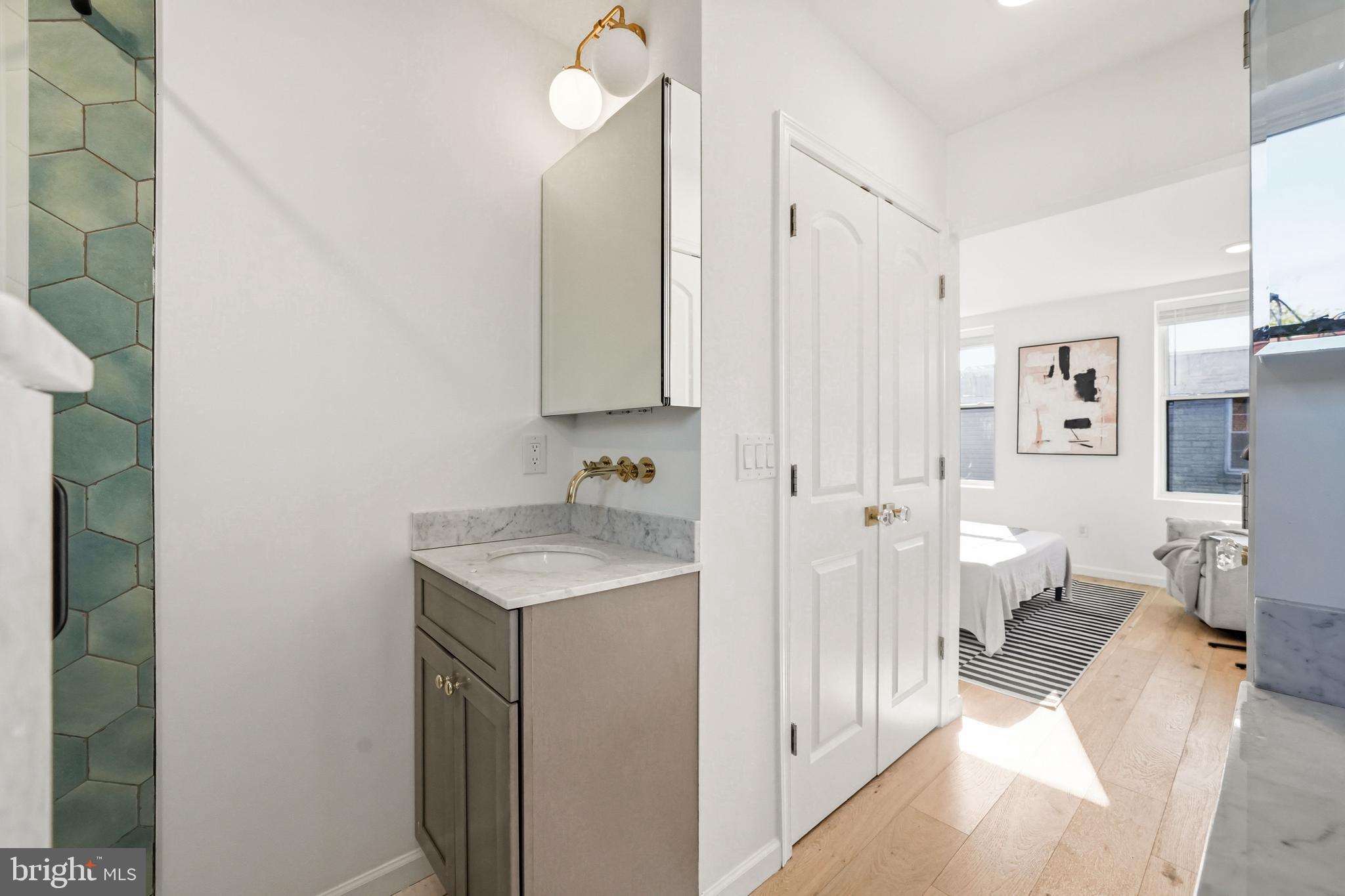 831 North Stillman Street Philadelphia, PA 19130 - Photo 31 of 35 a spacious bathroom with a granite countertop sink a toilet and a shower