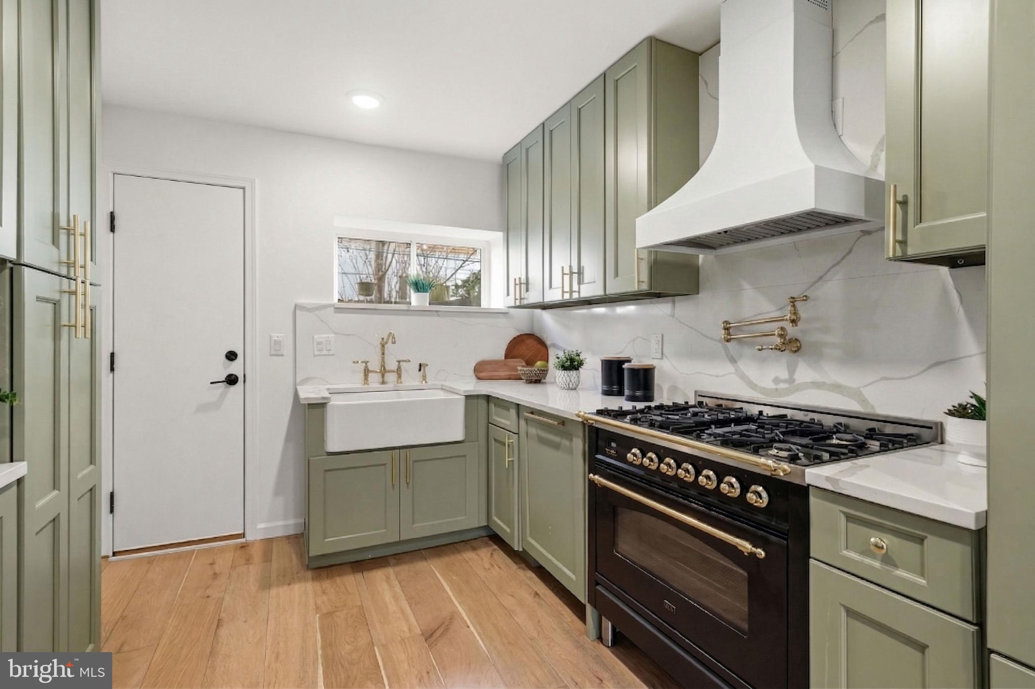 831 North Stillman Street Philadelphia, PA 19130 - Photo 5 of 35 a kitchen with stainless steel appliances a stove a sink and a refrigerator