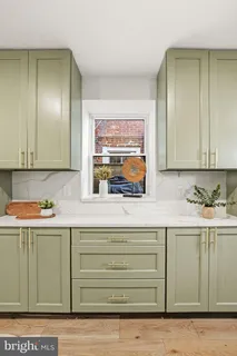 a kitchen with a sink and cabinets