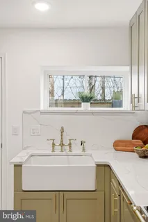 a bathroom with a sink and a window